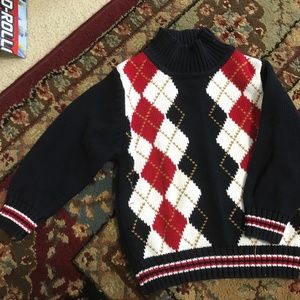 A little boy’s sweater in good condition